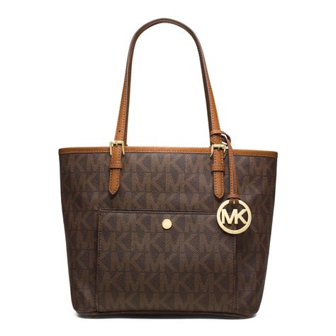 michael michael kors jet set logo medium travel tote review|michael kors bag with airplanes.